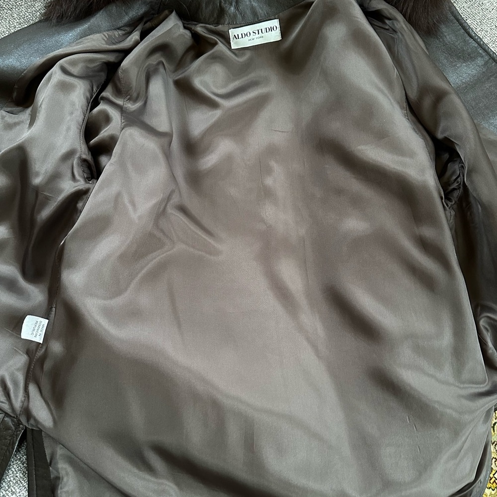 Leather jacket with faux fox trim